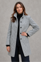 Women's classic longline winter coat with a tailored straight fit, button-front fastening, side pockets and elegant lapel collar, designed for warm, timeless autumn and winter styling.