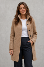 Women's classic longline winter coat with a tailored straight fit, button-front fastening, side pockets and elegant lapel collar, designed for warm, timeless autumn and winter styling.