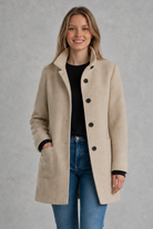 Women's classic longline winter coat with a tailored straight fit, button-front fastening, side pockets and elegant lapel collar, designed for warm, timeless autumn and winter styling.