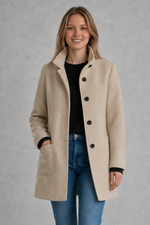 Women's classic longline winter coat with a tailored straight fit, button-front fastening, side pockets and elegant lapel collar, designed for warm, timeless autumn and winter styling.