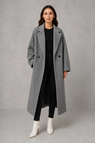 Women’s classic wool maxi coat with a relaxed longline silhouette, minimalist styling and traditional front button fastening for autumn and winter.