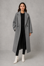 Women’s classic wool maxi coat with a relaxed longline silhouette, minimalist styling and traditional front button fastening for autumn and winter.