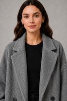 Women’s classic wool maxi coat with a relaxed longline silhouette, minimalist styling and traditional front button fastening for autumn and winter.
