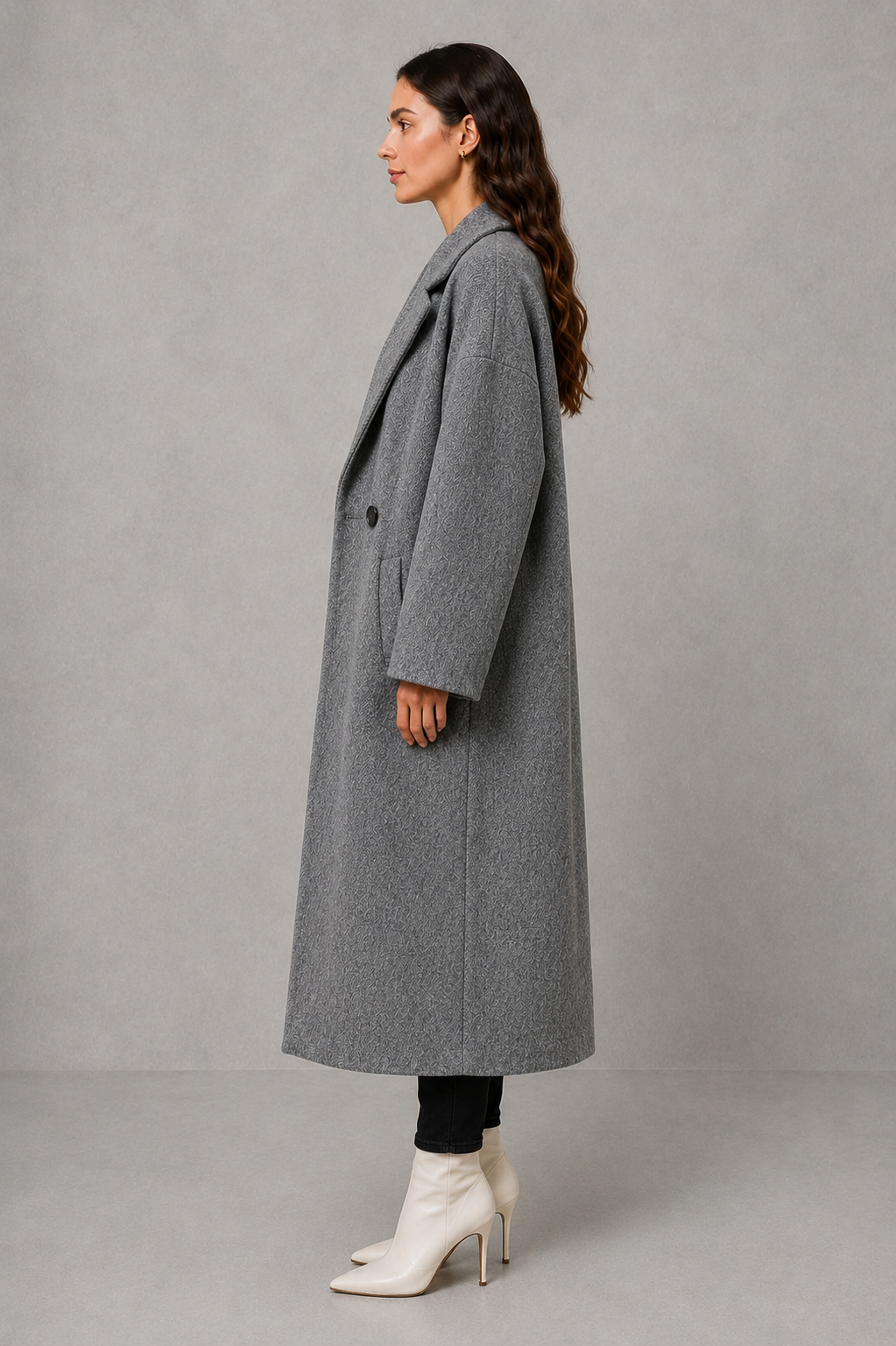 Women’s classic wool maxi coat with a relaxed longline silhouette, minimalist styling and traditional front button fastening for autumn and winter.