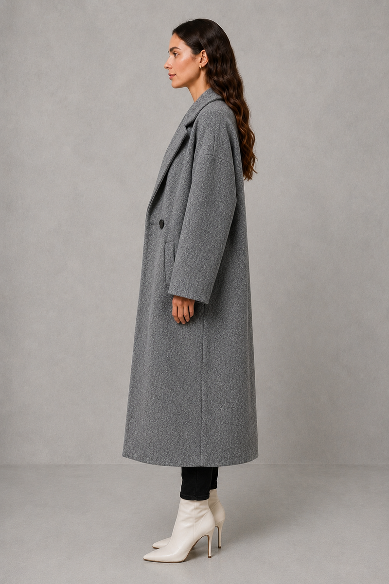 Women’s classic wool maxi coat with a relaxed longline silhouette, minimalist styling and traditional front button fastening for autumn and winter.