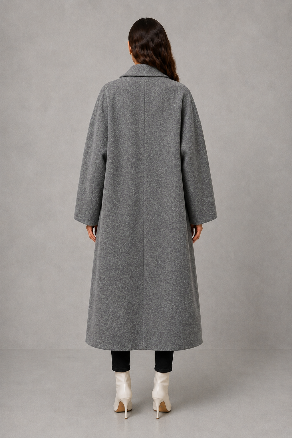 Women’s classic wool maxi coat with a relaxed longline silhouette, minimalist styling and traditional front button fastening for autumn and winter.