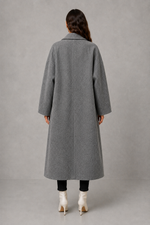 Women’s classic wool maxi coat with a relaxed longline silhouette, minimalist styling and traditional front button fastening for autumn and winter.