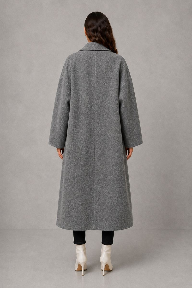 Women’s classic wool maxi coat with a relaxed longline silhouette, minimalist styling and traditional front button fastening for autumn and winter.