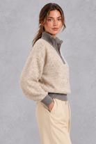 Women's oatmeal half-zip knitted jumper with contrast grey collar – side view