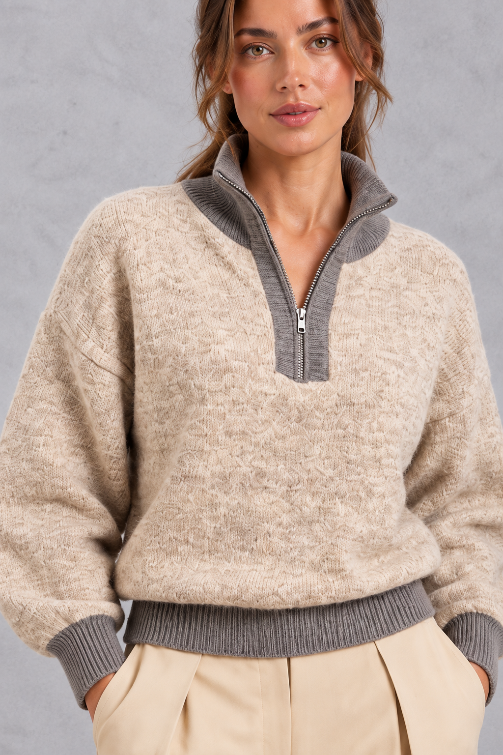 Women's oatmeal half-zip knitted jumper – close-up of textured knit, zip and grey ribbed collar