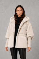 Women’s cosy longline hooded winter coat with soft lining for warm everyday wear