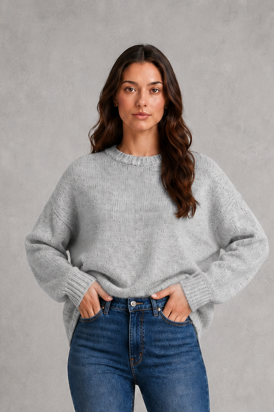 Light grey women’s crew neck knit jumper with an oversized relaxed fit, dropped shoulders and loose wide long sleeves.