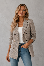 Women's double-breasted plaid blazer with a tailored fit, lapel collar, long sleeves and classic check pattern for work and smart casual occasions.