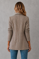 Women's double-breasted plaid blazer with a tailored fit, lapel collar, long sleeves and classic check pattern for work and smart casual occasions.