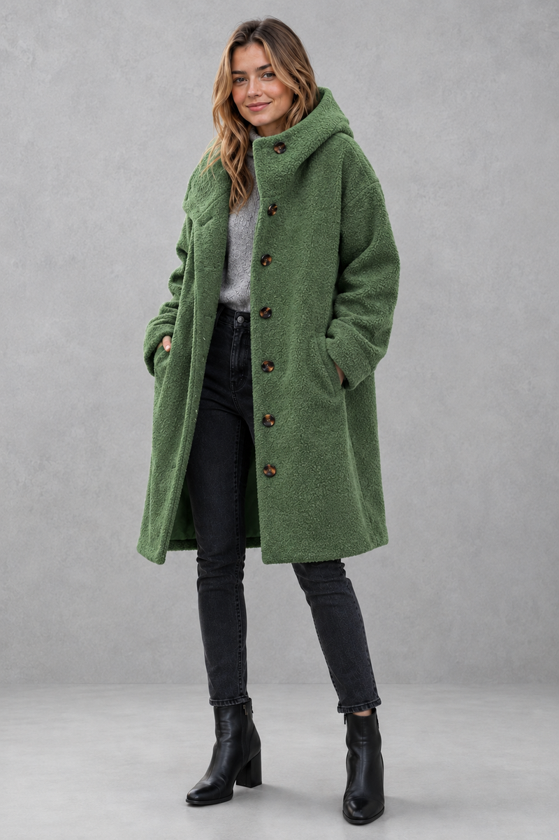 Women's elegant button-front autumn and winter coat with a relaxed fit, classic longline silhouette, soft warm fabric, long sleeves and timeless design, ideal for layering with knitwear, dresses or tailored outfits.