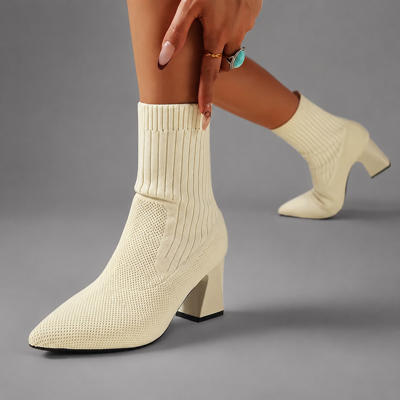 Women's elegant mid-calf slip-on boots with a soft fabric upper, supportive 7.2 cm chunky heel, bohemian-inspired design and durable rubber sole for stylish everyday wear.