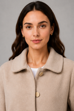 Women’s elegant oversized mid-length coat with spacious pockets and refined cuff detailing, designed for stylish autumn and winter layering.