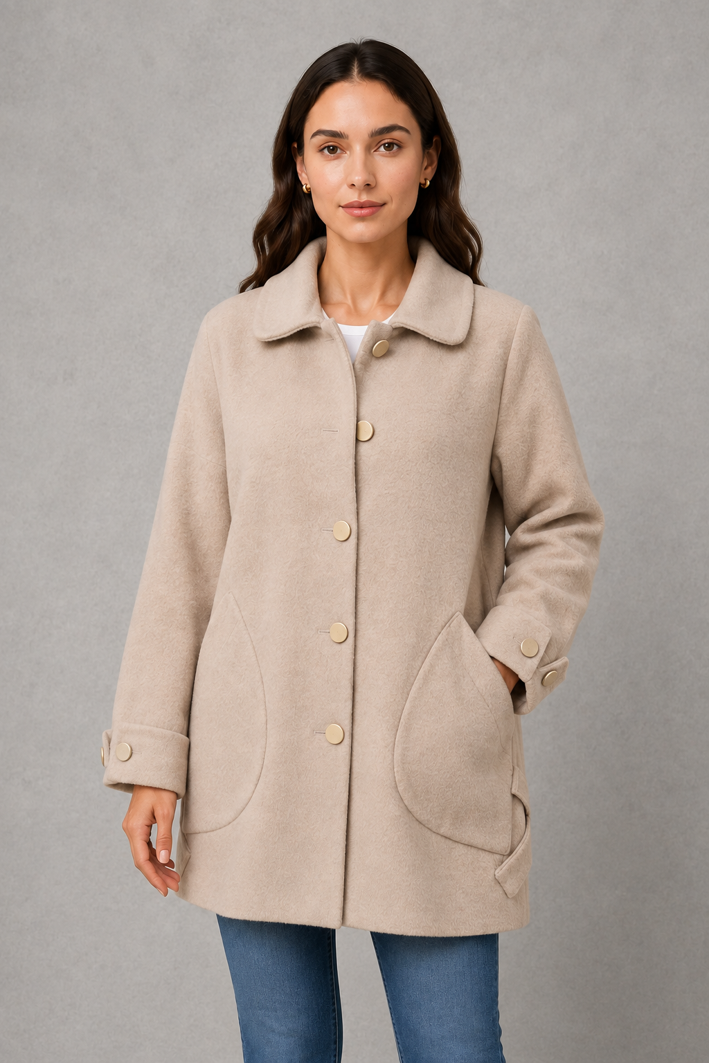 Women’s elegant oversized mid-length coat with spacious pockets and refined cuff detailing, designed for stylish autumn and winter layering.