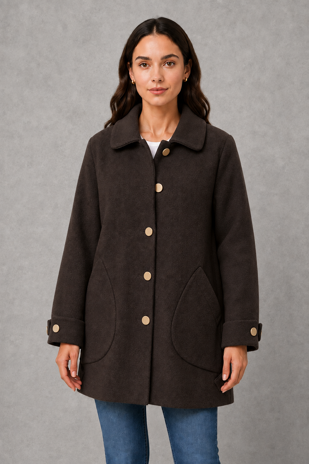 Women’s elegant oversized mid-length coat with spacious pockets and refined cuff detailing, designed for stylish autumn and winter layering.