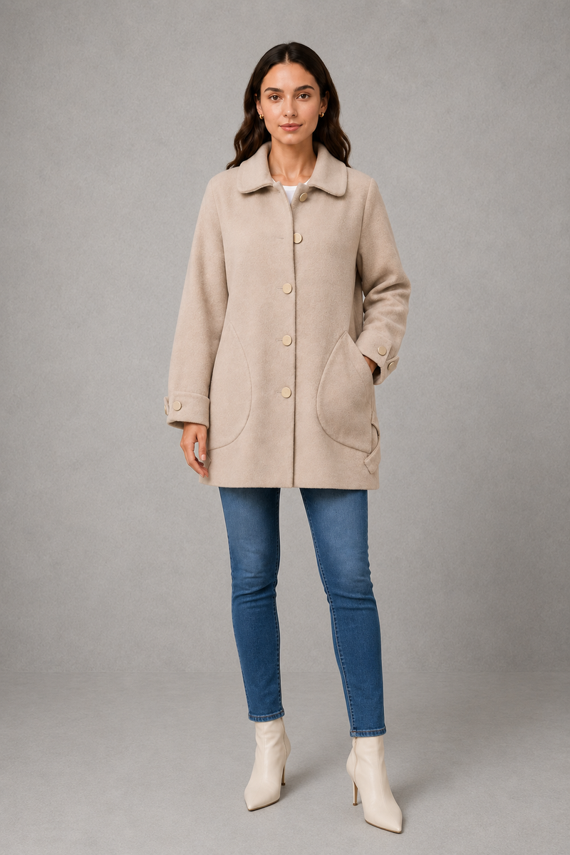 Women’s elegant oversized mid-length coat with spacious pockets and refined cuff detailing, designed for stylish autumn and winter layering.