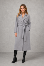 Women's elegant wrap coat in a longline design with a tailored lapel collar and adjustable matching waist belt, offering a flattering regular fit and lightweight warmth for autumn and winter wear.
