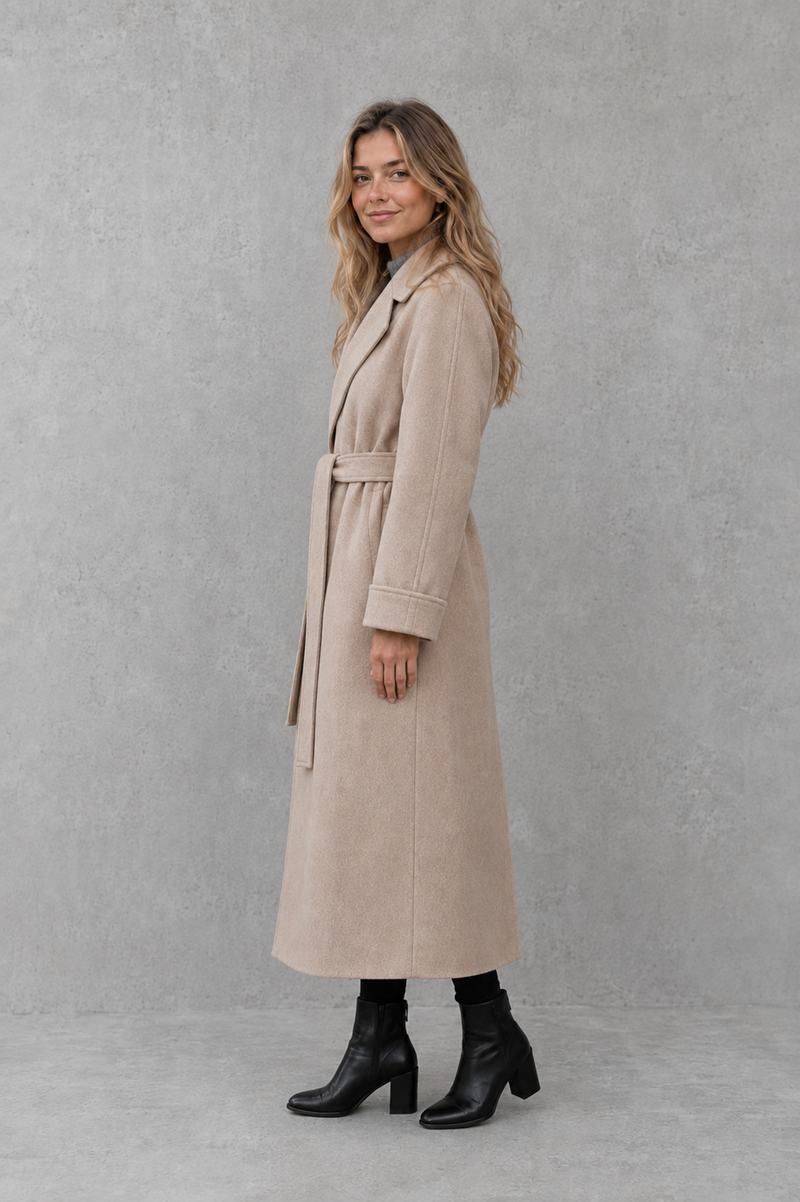 Women's elegant wrap coat in a longline design with a tailored lapel collar and adjustable matching waist belt, offering a flattering regular fit and lightweight warmth for autumn and winter wear.