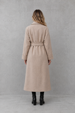 Women's elegant wrap coat in a longline design with a tailored lapel collar and adjustable matching waist belt, offering a flattering regular fit and lightweight warmth for autumn and winter wear.