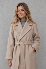 Women's elegant wrap coat in a longline design with a tailored lapel collar and adjustable matching waist belt, offering a flattering regular fit and lightweight warmth for autumn and winter wear.