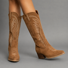 Women's embroidered western cowboy boots in a knee-high design with a soft suede-look finish, decorative stitching, mid-height heel, side zip fastening and durable TPR sole, ideal for everyday autumn and winter wear.