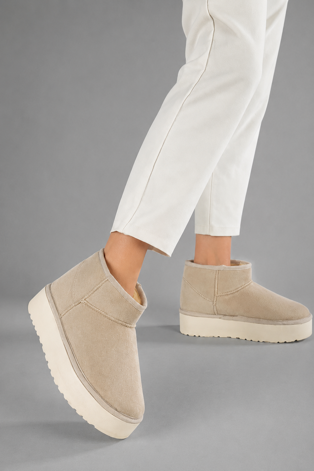 Women's faux suede platform snow boots with a soft faux fur lining, slip-on ankle-height design, round toe, back pull tab, 1.75-inch platform sole and non-slip outsole for warm, comfortable winter everyday wear.
