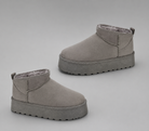 Women's faux suede platform snow boots with a soft faux fur lining, slip-on ankle-height design, round toe, back pull tab, 1.75-inch platform sole and non-slip outsole for warm, comfortable winter everyday wear.