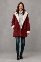 Women’s fleece-lined winter coat with a soft cosy interior, flattering feminine silhouette and elegant design for everyday cold-weather wear.
