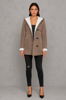 Women’s fleece-lined toggle coat with hood, designed for warm and cosy autumn and winter wear.