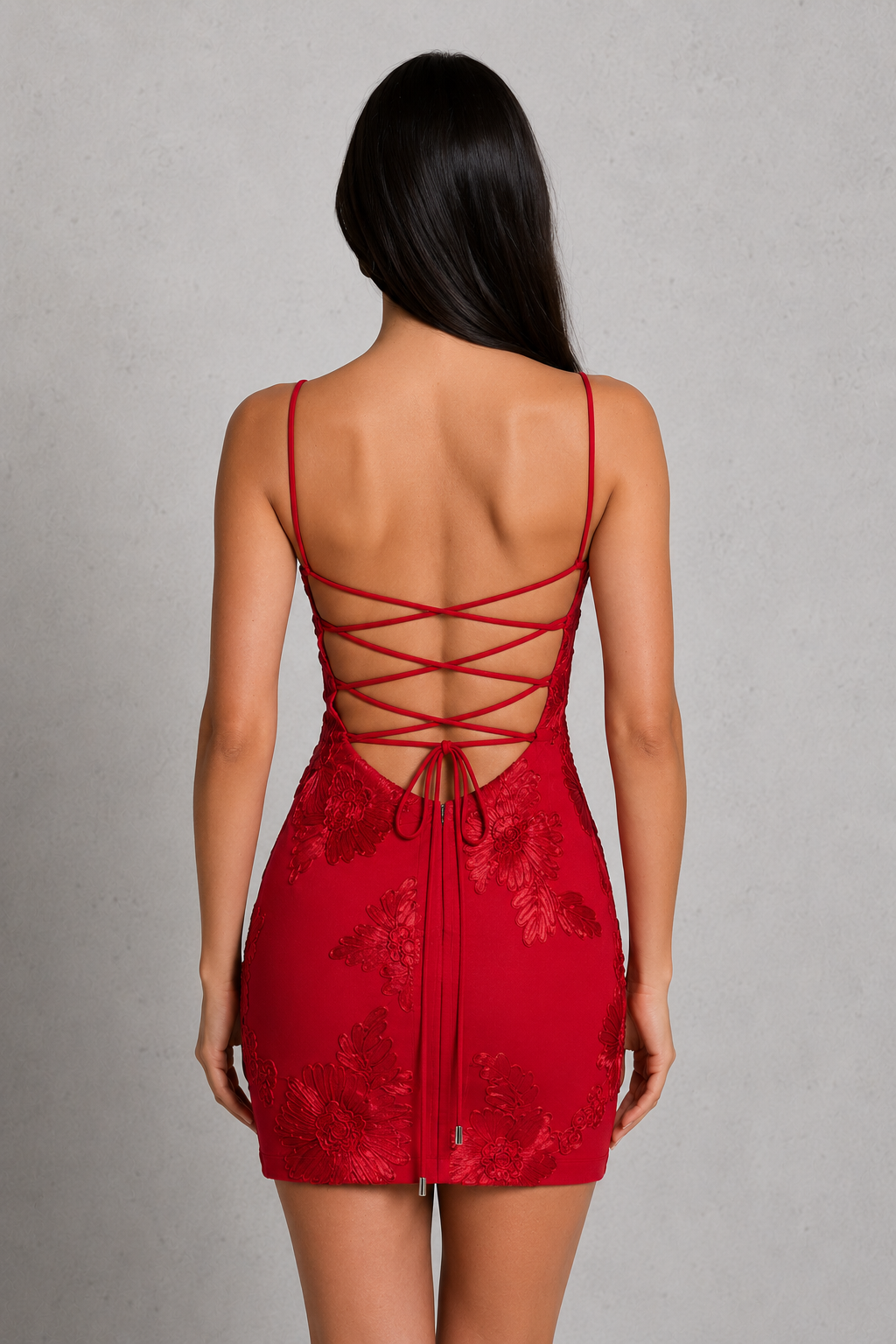 Red lace dress with open back on a gray background