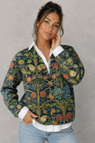 Women's floral knit open-front cardigan in a soft knitted fabric with a relaxed fit, featuring an elegant floral pattern, long sleeves, and a lightweight design for comfortable everyday layering during cooler seasons.