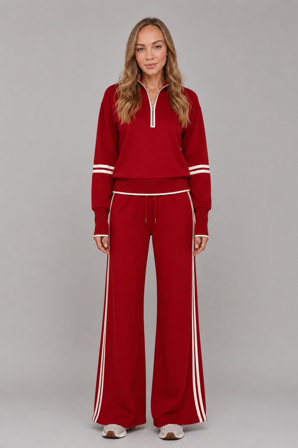 Women's half zip lounge set featuring a relaxed fit sweatshirt with a funnel neckline, contrast stripe detailing, and matching wide leg trousers with an elasticated drawstring waistband in soft stretch fabric.
