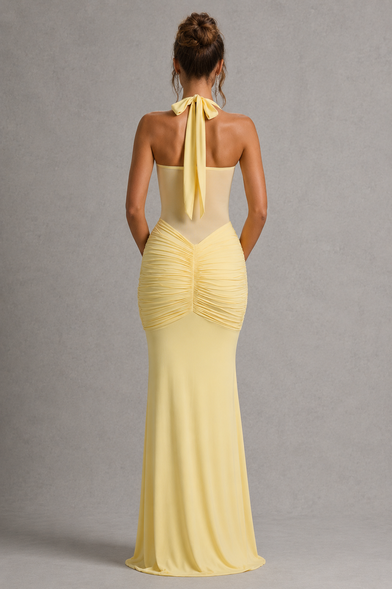 Yellow evening gown with a plain gray background