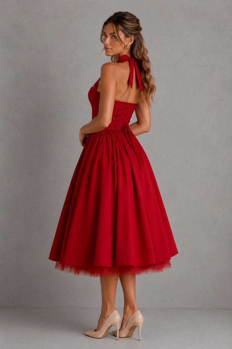 Red dress with a halter neck and full skirt on a gray background