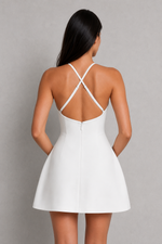 White dress with thin straps on a gray background