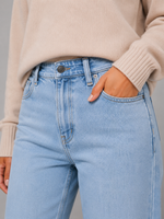 Women’s high waisted wide leg jeans in light wash denim with a relaxed straight leg, classic five-pocket design and button-and-zip fastening.