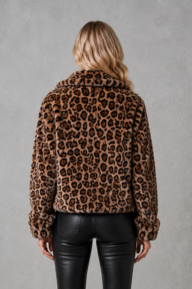 Women's leopard print faux fur cropped jacket with long sleeves, relaxed fit and soft plush texture, styled as a warm and lightweight winter coat.