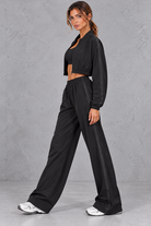 Women's black cropped zip-up jacket and wide leg trouser fitness set – side view