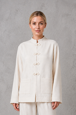 Women's white mandarin collar tailored jacket with a relaxed fit, clean front fastening and structured silhouette, ideal for smart casual, office and formal wear.