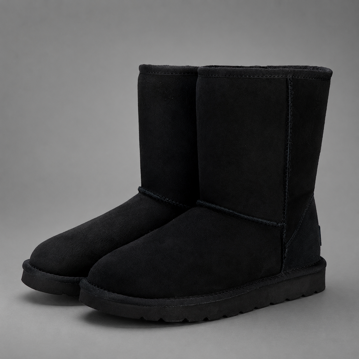Women's mid-calf faux sheepskin winter boots with a soft cotton upper, corduroy shaft, plush lining, round toe and lightweight flat sole in a slip-on design for warm everyday winter comfort.