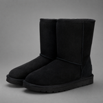 Women's mid-calf faux sheepskin winter boots with a soft cotton upper, corduroy shaft, plush lining, round toe and lightweight flat sole in a slip-on design for warm everyday winter comfort.