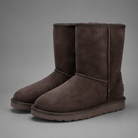Women's mid-calf faux sheepskin winter boots with a soft cotton upper, corduroy shaft, plush lining, round toe and lightweight flat sole in a slip-on design for warm everyday winter comfort.