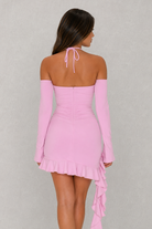 Pink off-shoulder dress with long sleeves on a plain background