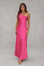 Woman wearing a pink one-shoulder dress against a gray background