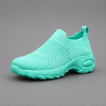 Women's orthopaedic slip-on trainers with a breathable stretch-knit upper, chunky cushioned sole and lightweight design, offering all-day comfort for walking, commuting, travel and everyday casual wear.