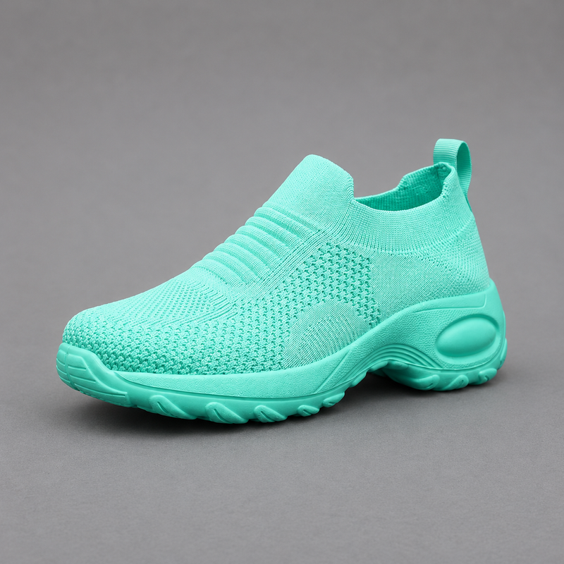 Women's orthopaedic slip-on trainers with a breathable stretch-knit upper, chunky cushioned sole and lightweight design, offering all-day comfort for walking, commuting, travel and everyday casual wear.